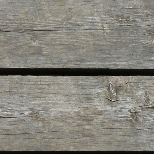 Grey planks set horizontally with wide shafts in between.